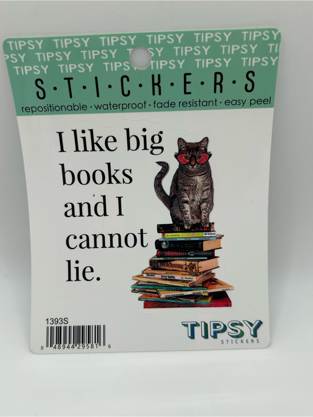“I like big books and I cannot lie.” Sticker with cat on stack of books 🐈📚